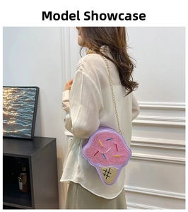 Detailed side view of ice cream shaped crossbody bag with pink glitter and gold chain