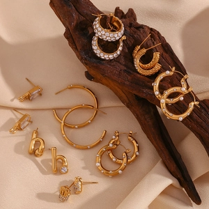 Detailed assortment of 18K gold plated earrings with micro-inlaid zircons and pearls