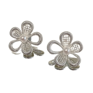 Elegant silver flower pearl stud earrings with a hollow floral design and white pearl center