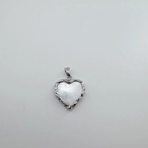 Detailed close-up of 18K gold-plated heart pendant featuring natural white shell inlay