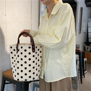 French vintage polka dot canvas bucket bag with brown handles and large interior