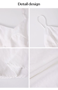 Detail view of white V-neck dress with thin straps and textured fabric design