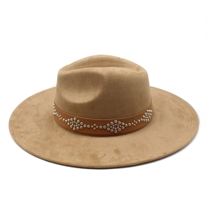 Detail of camel suede fedora hat with studded leather band and wide brim design