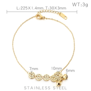 Gold stainless steel anklet with ancient coin and bell charms on a clean white background