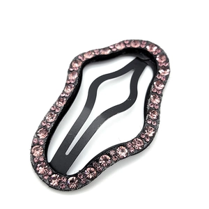 Sparkling pink rhinestone wavy BB hair clip for women with a sleek black frame finish