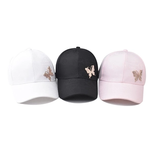 Classic cotton baseball cap with floral relief and rhinestone butterfly ornament