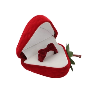 Red velvet strawberry ring box with a sweet bow-knot ring on a clean white background