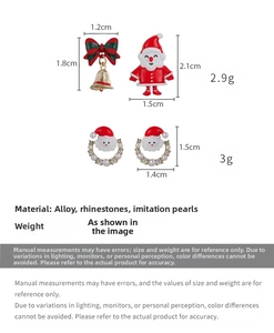 Detail view of asymmetric Santa and bell earrings with size and weight measurements