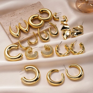 20-piece gold irregular geometric textured earrings set on elegant satin background