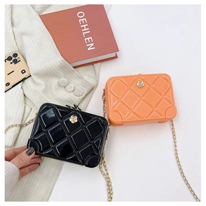 Miniature jelly suitcase crossbody bags in black and orange with chic chain straps