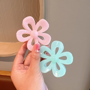 Elegant jelly pink and blue camellia flower hair claws for a minimalist hair style