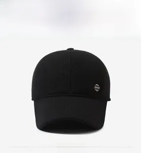 Detail view of the dense knit texture and sport metal logo on this black men baseball cap