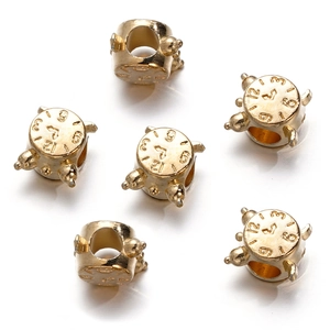 Detailed close-up of golden alarm clock shaped CCB beads for DIY jewelry making