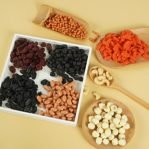 Flat lay of realistic PVC artificial dried fruits and nuts in wooden trays for display