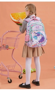 Close-up of purple unicorn kids backpack with sequins and decorative brand patch