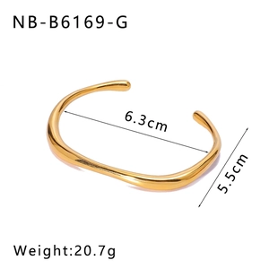 Detailed view of irregular 18k gold plated stainless steel cuff with size and weight specs