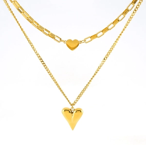 Detail of double-layer gold heart necklace with rectangular links and long heart pendant