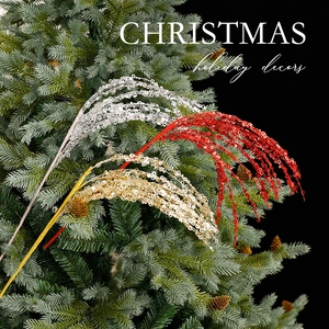 Sparkling Christmas tree glitter branches in red, gold, and silver festive holiday decor