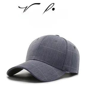Detail view of the gray plaid fabric and 6-panel structure of the cotton baseball cap