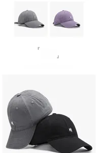 Detail view of cotton baseball caps with H embroidery in charcoal, purple and black