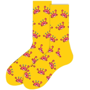 Detail shot of bright yellow knitted socks featuring a vibrant red cartoon crab pattern
