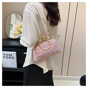 Chic rainbow tweed handbag with gold circular handle and metallic chain strap detail