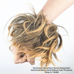 Detail view of messy bun hair scrunchie in color 4/144B with mixed brown and golden tones