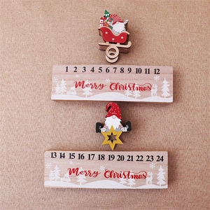 Macro shot of wooden Christmas advent calendar sliders with Merry Christmas text