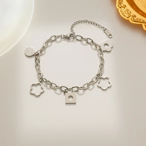 Bracelet en acier inoxydable argenté avec pendentifs fleurs et géométriques sur plateau