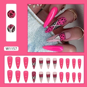 Long stiletto press-on nails with hot pink leopard print and silver glitter accents