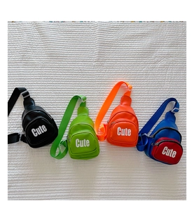 Flat lay of mini crossbody chest bags for boys in black, green, orange, and blue colors