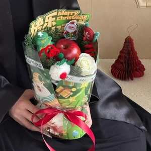 Christmas flower bouquet with red apple, white rose and holiday bear pattern wrapping