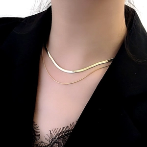 Double layered gold snake bone necklace for women in a minimalist elegant style