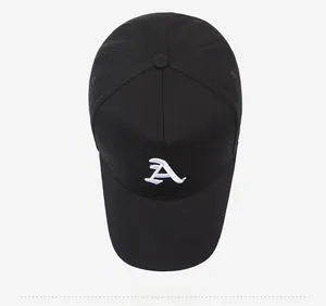Top down view of black cotton baseball cap featuring white embroidered letter A detail