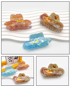 Cowboy hat shaped acrylic hair claws in amber and patterned blue for stylish hair styling