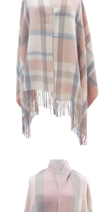 Detailed view of pink, beige, and blue plaid scarf with elegant fringed edges and soft texture