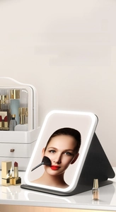 Detail of folding makeup mirror with tricolor LED light source and smart touch controls