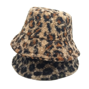 Plush faux lamb wool bucket hat with leopard print for winter warmth and fashion