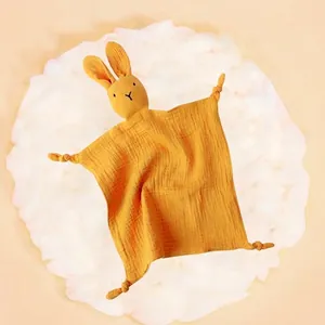Soft yellow bunny baby security blanket made of organic muslin cotton with corner knots