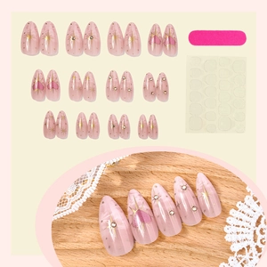 Long almond press-on nails set with pink heart gradient, rhinestones, and star patterns