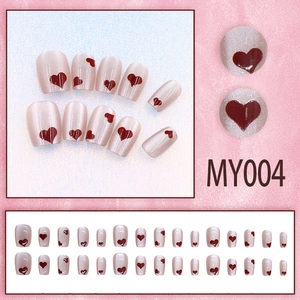 Short cat-eye press-on nails with red heart patterns and sparkling pink glitter finish