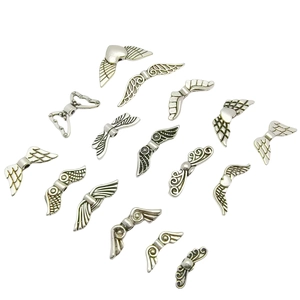 Collection of silver angel wing metal beads for DIY jewelry and handicraft making