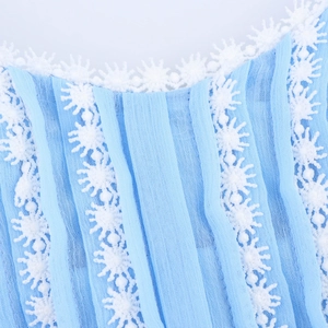 Blue chiffon dress featuring delicate white lace trim and vertical pleated details