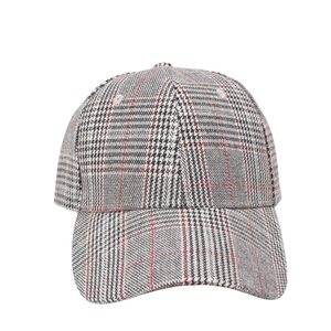 Macro detail of retro Glen Check pattern and stitching on a classic baseball cap