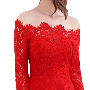 Close-up of red off-shoulder lace evening dress with delicate eyelash trim detailing