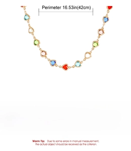 Detailed specs of heart charm necklace featuring colorful crystal beads and golden chain