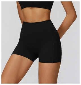 Close-up of high-waisted black yoga shorts showing compression fabric and stitching