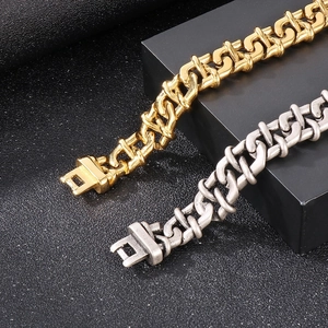 Close-up of chunky infinity chain links in gold and antique silver stainless steel