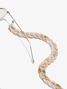 Detail view of cream and light coffee marbled acrylic eyewear chain links