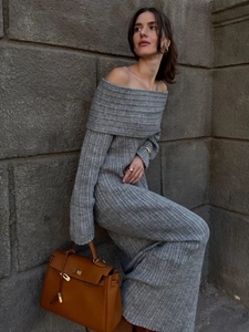 Close-up of the elegant rib-knit vertical texture on this grey off-shoulder dress